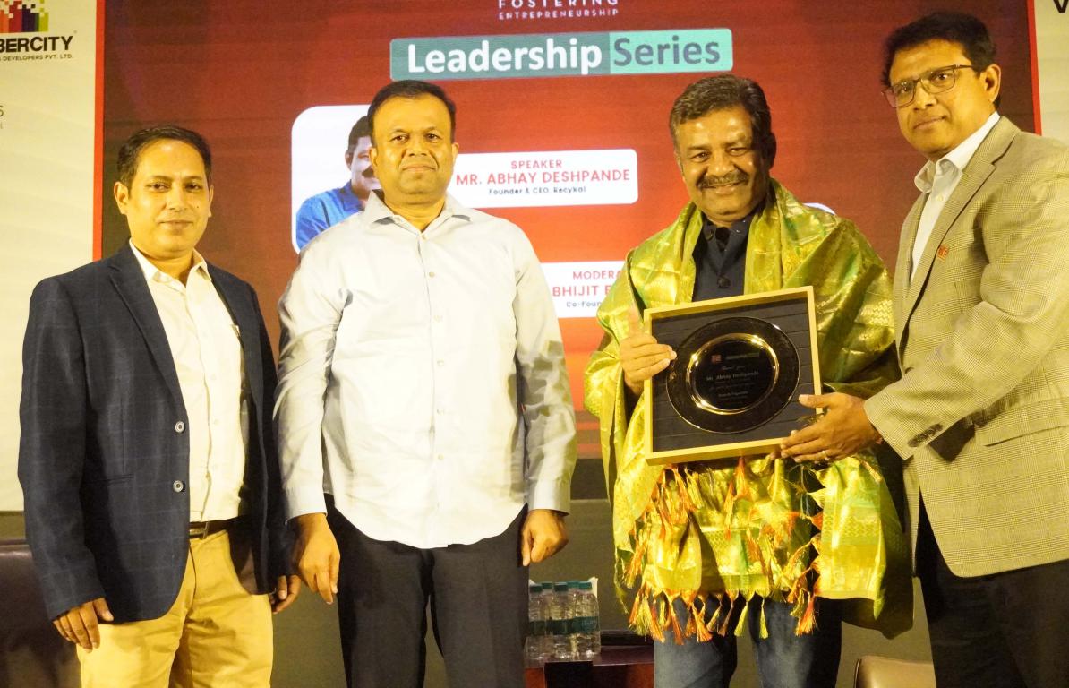 Seen Abhijit Banerjee_ Murali Kakarla_Rajesh Pagadala_ felicitating Abhay Deshpande speaker at the Leadership Series