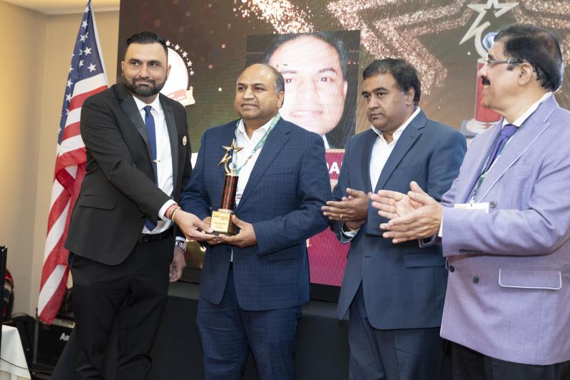 Kumar Sadaram receiving the award