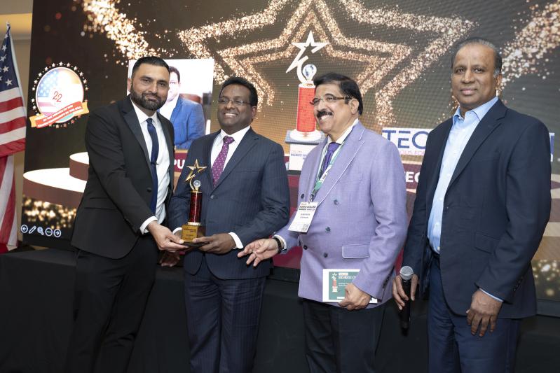 Lax Chepuri receiving the award