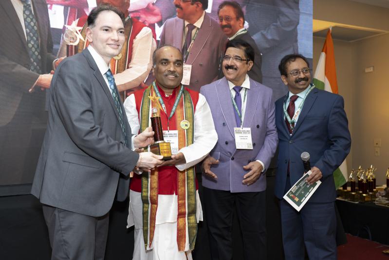 Raju Chamarthy receiving the award