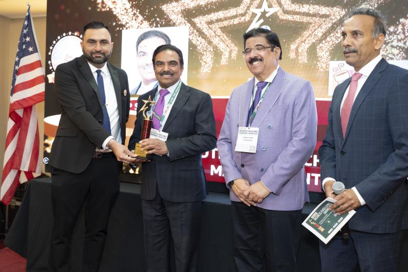 TP Srinivas receiving the award