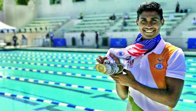 ట్రిపుల్ క్రాన్ ఈదిన.. తొలి ఇండియన్ పోలీస్ గా రికార్డు