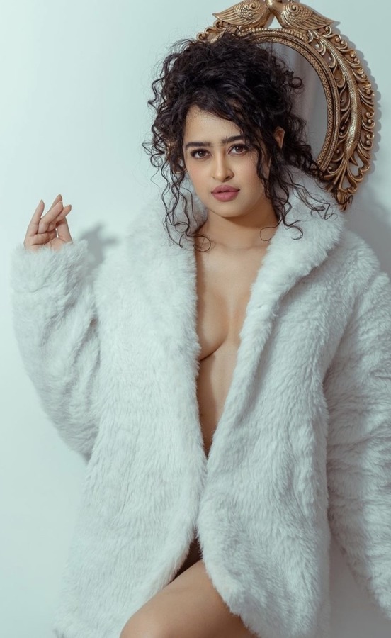 వైట్ కోట్ లో అప్స‌ర రాణి బోల్డ్ లుక్