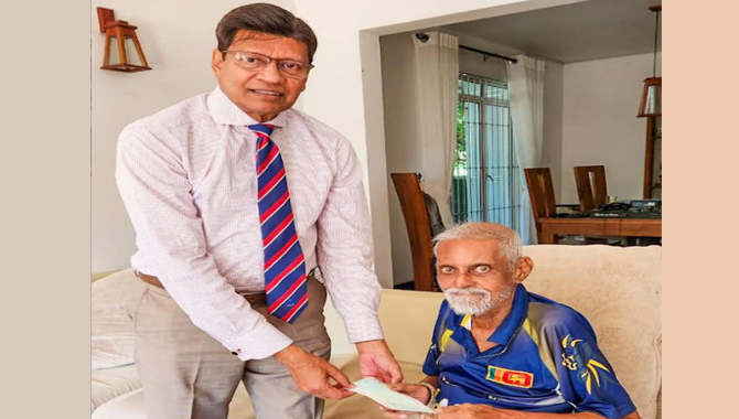 Sri Lanka Cricket presents Rs. 5 million to Percy towards his health and wellbeing